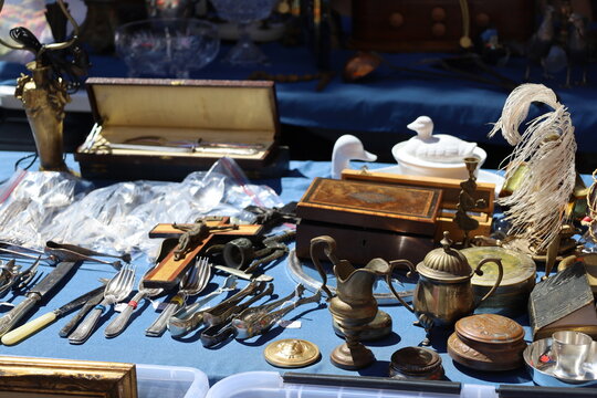 bunch of vintage items on sale at the flea market