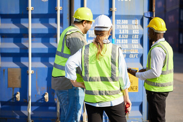 back view group of workers checking inside container in warehouse storage