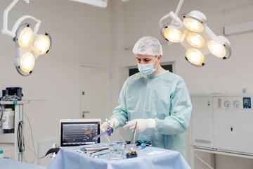 Person in hospital operating room with lights on