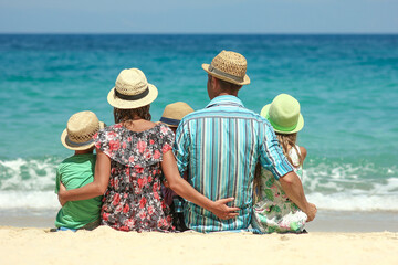 A Happy family with children on the coast of the sea travel