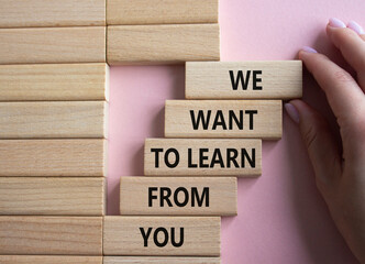 We want to learn from you symbol. Wooden blocks with words We want to learn from you. Beautiful...