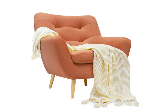 Comfortable coral pink armchair with white plaid isolated on white background.