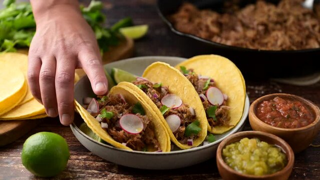 carnitas tacos with salsa and lime