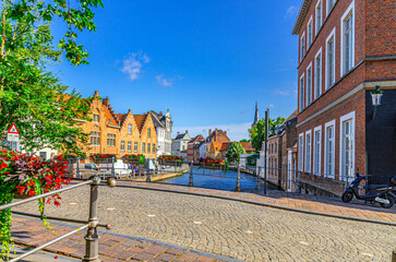 Bruges cityscape, Mill Bridge Molenbrug across Sint Annarei water canal, promenade embankment in Brugge old town, medieval houses in Bruges city historical centre, West Flanders province, Belgium - obrazy, fototapety, plakaty