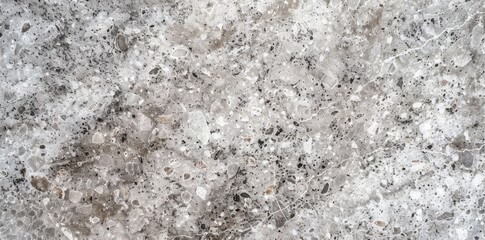 Detailed close-up view of a smooth marble surface, showcasing intricate veining and patterns characteristic of natural stone material.