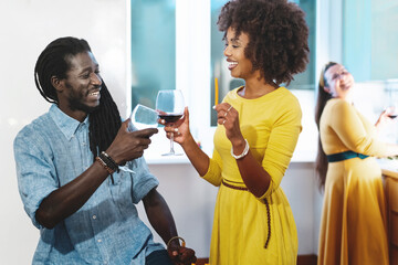 Joyful Multiracial Friends Toasting at Dinner Party