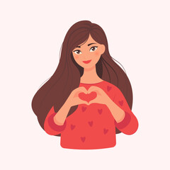 Beautiful girl in a red sweater making heart shape with hands. The concept of self love. Happy woman with love in heart