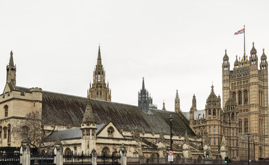 The Palace of Westminster is the meeting place of the House of Commons and the House of Lords, the two houses of the Parliament. Space for text, Selective focus. - obrazy, fototapety, plakaty