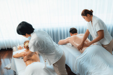Caucasian couple customer enjoying relaxing anti-stress spa massage and pampering with beauty skin...