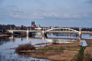 flooded meadow and road bridge over the Warta River in the city of Poznan - obrazy, fototapety, plakaty