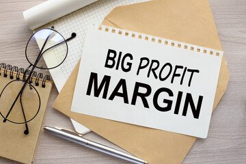 Big Profit Margins text on the page on the envelope. - obrazy, fototapety, plakaty