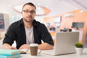 Portrait of attractive man in office at work