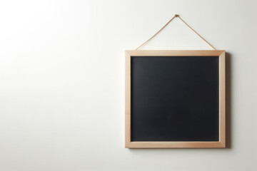 A blank chalkboard hangs on the wall. Space for text.