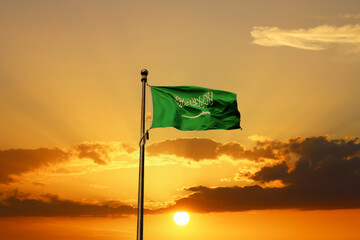 Saudi Arabia national flag waving at sunset. Islamic religion flag.