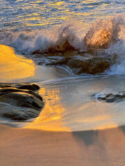 Sunset Symphony: Waves Crashing on Glistening Shores