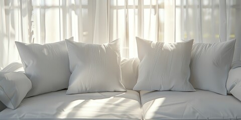Serene couch adorned with pristine white cushions in bright natural light
