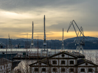 Industrial Silhouettes: Shipyard Cranes at Dusk