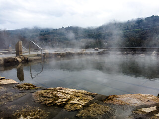 Misty Thermal Spring by the Mountainside