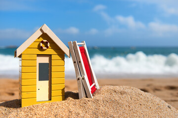 Beach cabin and folded chair - 750888254