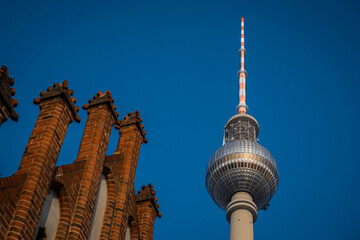 Tv tower in Berlin, on Alexanderplatz square on a clear spring day. Prominent tall building in...