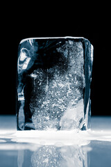 Crystal clear, textured, natural ice block, on a black background. Clipping path included.