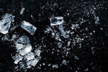 A crushed ice pieces on a dark ice background.