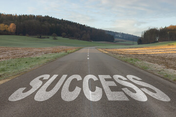 Success text written on road concept for business planning strategies and challenges or career path opportunities and change, road to success concept, Success word on street.