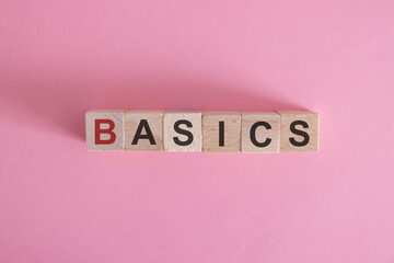 Basics symbol. Concept word Basics on wooden cubes. Beautiful white background. Business and Basics...