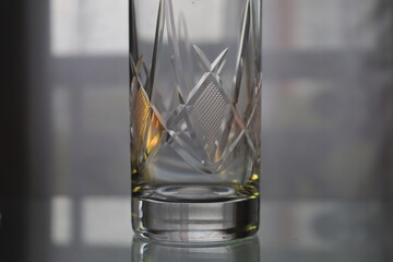 ornamentad crystal glass with orange light reflections