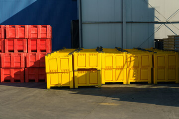 Stacked Colorful Industrial Containers at Outdoor Storage Facility in Daylight