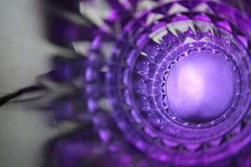 psychedelic glass vortex with pruple relfective light