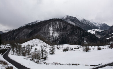 Naklejka premium Deep winter snow in Val Pontebbana, north of Pontebba in Udine Province, Friuli-Venezia Giulia, North East Italy. Late February