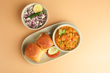 Mumbai Style Pav bhaji is a fast food dish from India, consists of a thick vegetable curry served with a soft bread roll