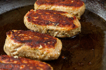 Lula lamb cutlets fried in a frying pan close-up