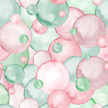 Abstract seamless pattern. Small and big polka dots. Pastel pink and green trendy colors. Circle, confetti. Splashes, bubbles, round doodle spots. Watercolor background.