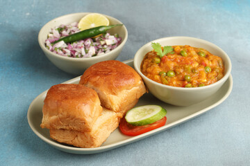 Mumbai Style Pav bhaji is a fast food dish from India, consists of a thick vegetable curry served...