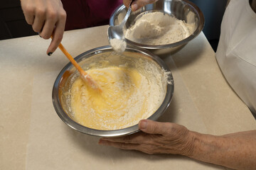 Closeup of the final mixing og the ingredients needed to make rosquillas, a traditional dessert in Spain made for Christmas.