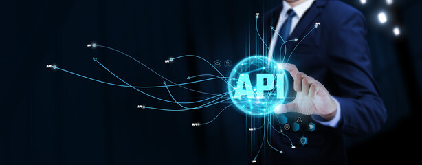API: Businessman Touching Digital Global Network of API Data Exchange. Seamless Integration on...