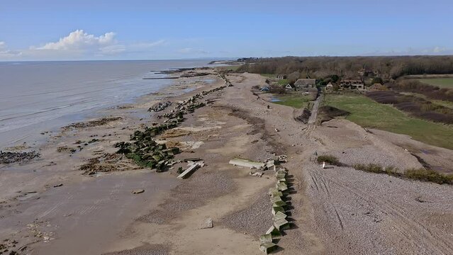 Atherington and Climping beach in West Sussex and the broken sea defence and the temporary shingle bank in place to protect the land, aerial.