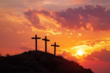 Three crosses on a hill with dramatic sunset in the background