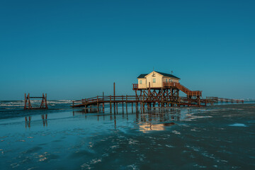 Pile dwelling on the beach of Sankt Peter-Ording in Germany.