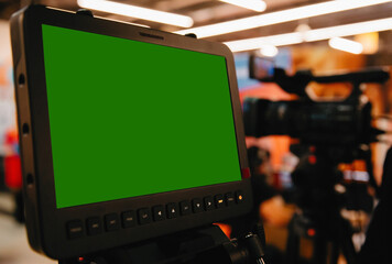 Close up of video camera monitor with big chroma key screen