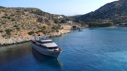 Fototapeta na wymiar Luxury yacht anchored in Aegean island bay, Greece
