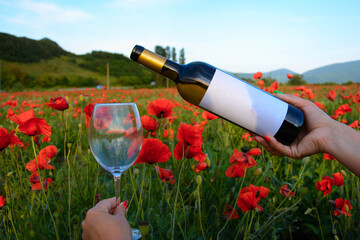 Bottle of wine in a flower field - 750930655