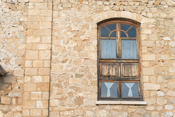 medieval windows in stone wall inside  Kruje castle in Albania 