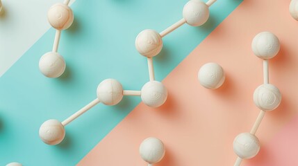 Wooden balls connected like a molecule structure on dual-tone background