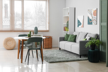 Stylish comfortable living room with sofa, table and shelving unit