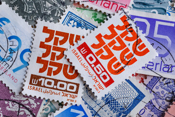 Ukraine, Kiyiv - January 12, 2023 Israeli Postage stamp.Postage stamps.A collection of world stamps in a pile.Postage stamps from different countries and times