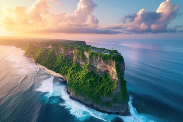 Aerial view of Uluwatu cliff landscape surrounded by the vast ocean.