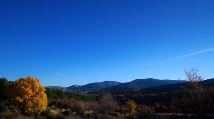 Autumn Landscape with Blue Sky and Rolling Hills